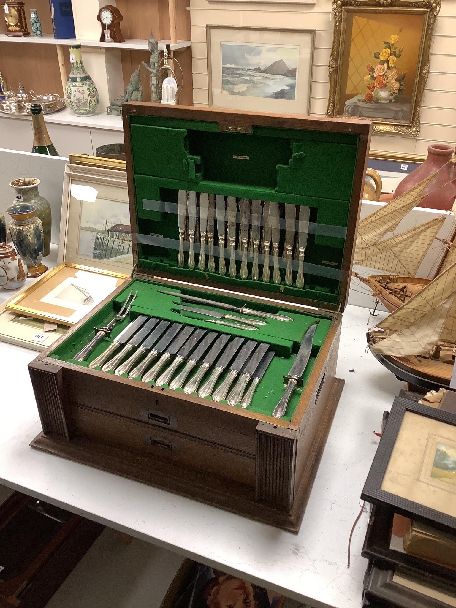 A set of three silver menu holders and a part service of Community Plate, in 1930's oak table canteen